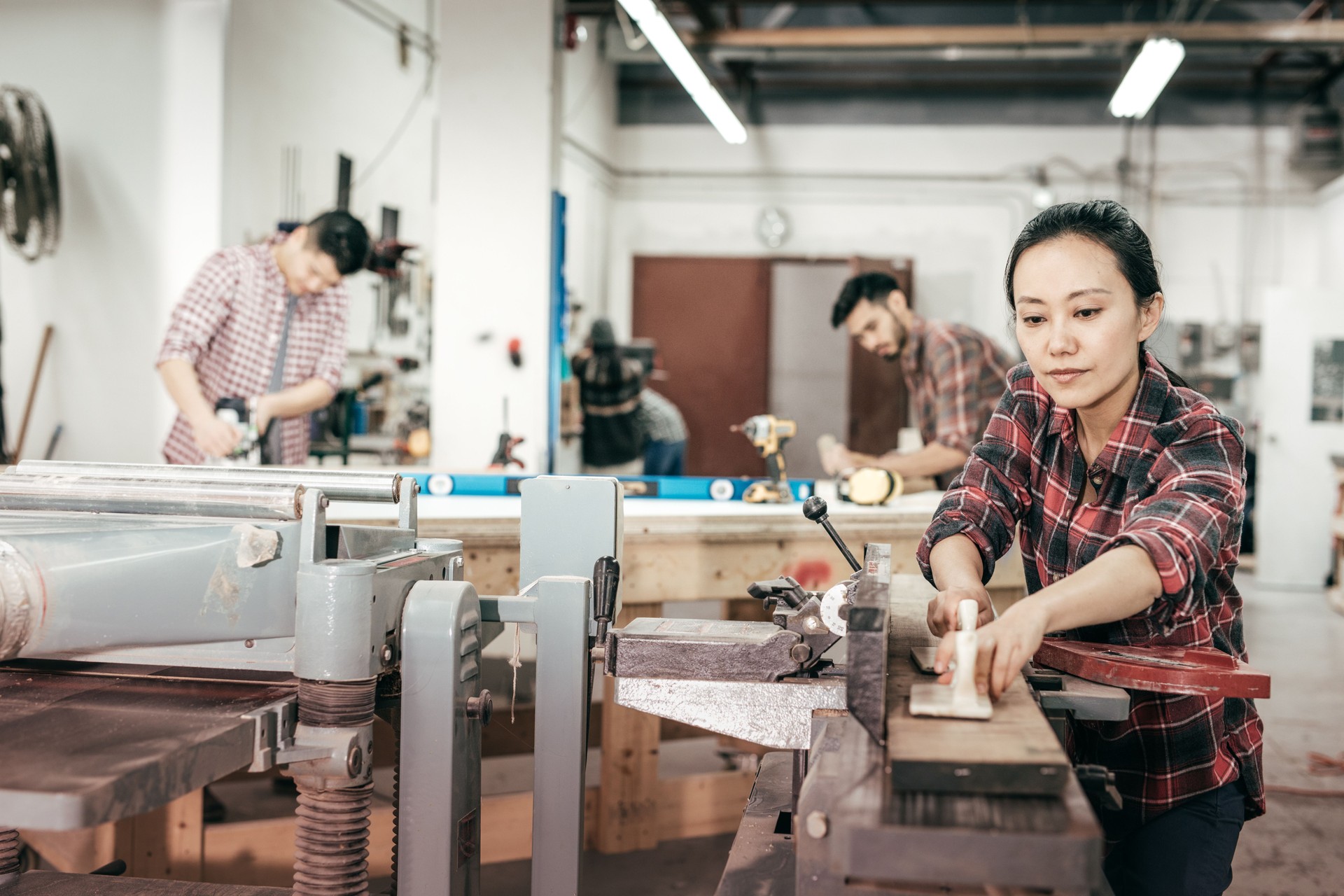 Female furniture designer at woodworking studio
